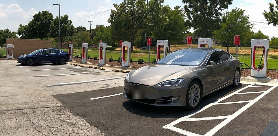 Used EV bargains: 1-3 year old electric cars lined up at charging stations