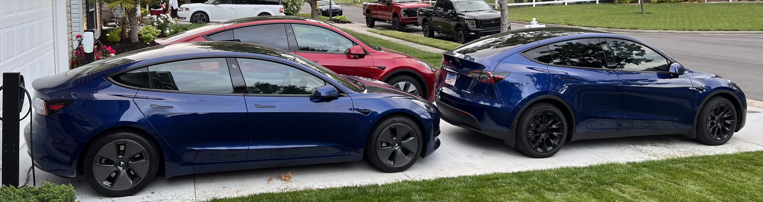 Darrell's three Teslas in his driveway — the fleet behind TheEVAuthority