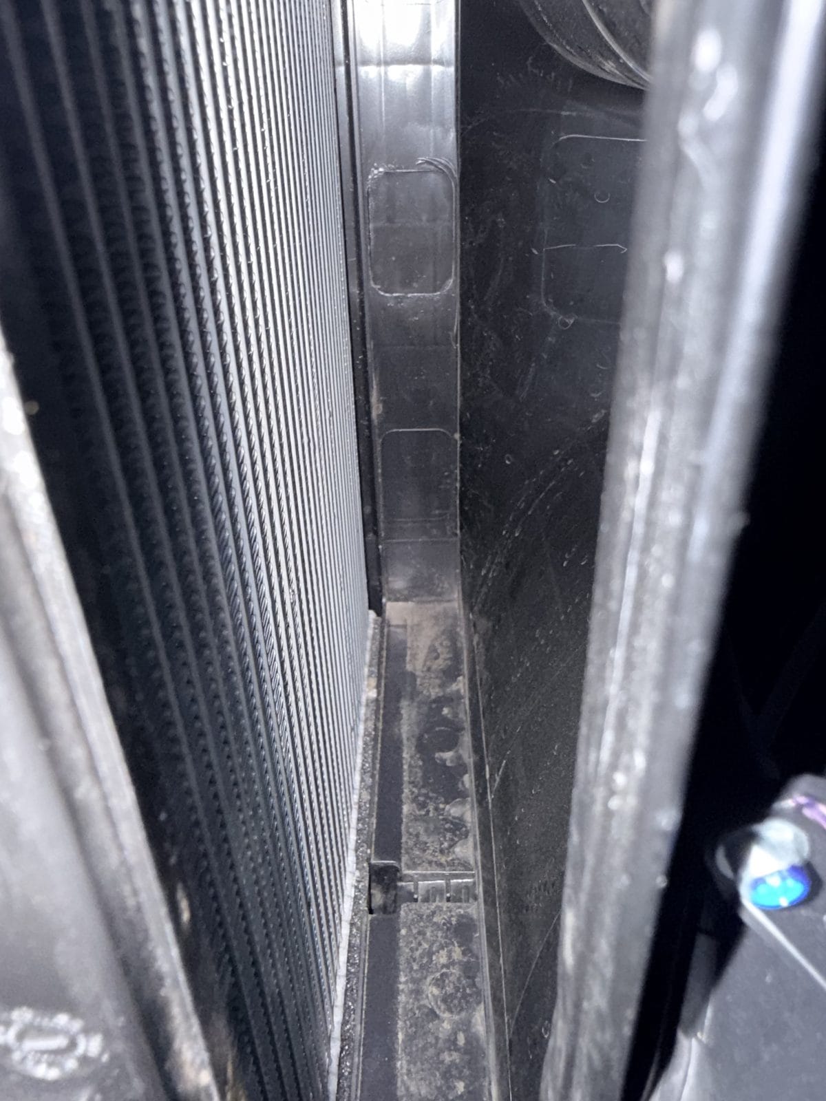 Tesla AC smells musty because of the mildew film on this dirty evaporator coil behind the cabin filter