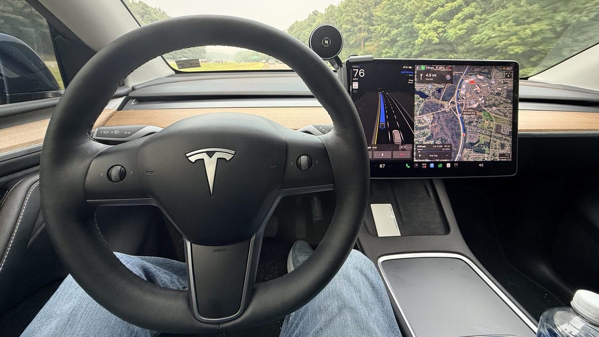 Is Tesla FSD worth it — Full Self-Driving v14 engaged on a 2023 Model Y with Hardware 4, hands-free on the highway