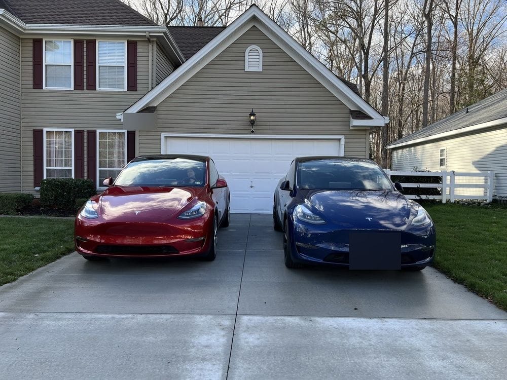 My 2023 and 2024 Tesla Model Ys in the driveway