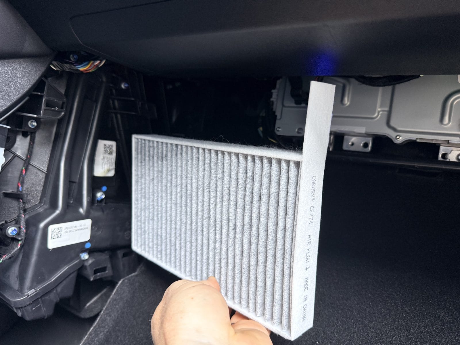 New CARORY cabin filter showing the air flow direction arrow before installation