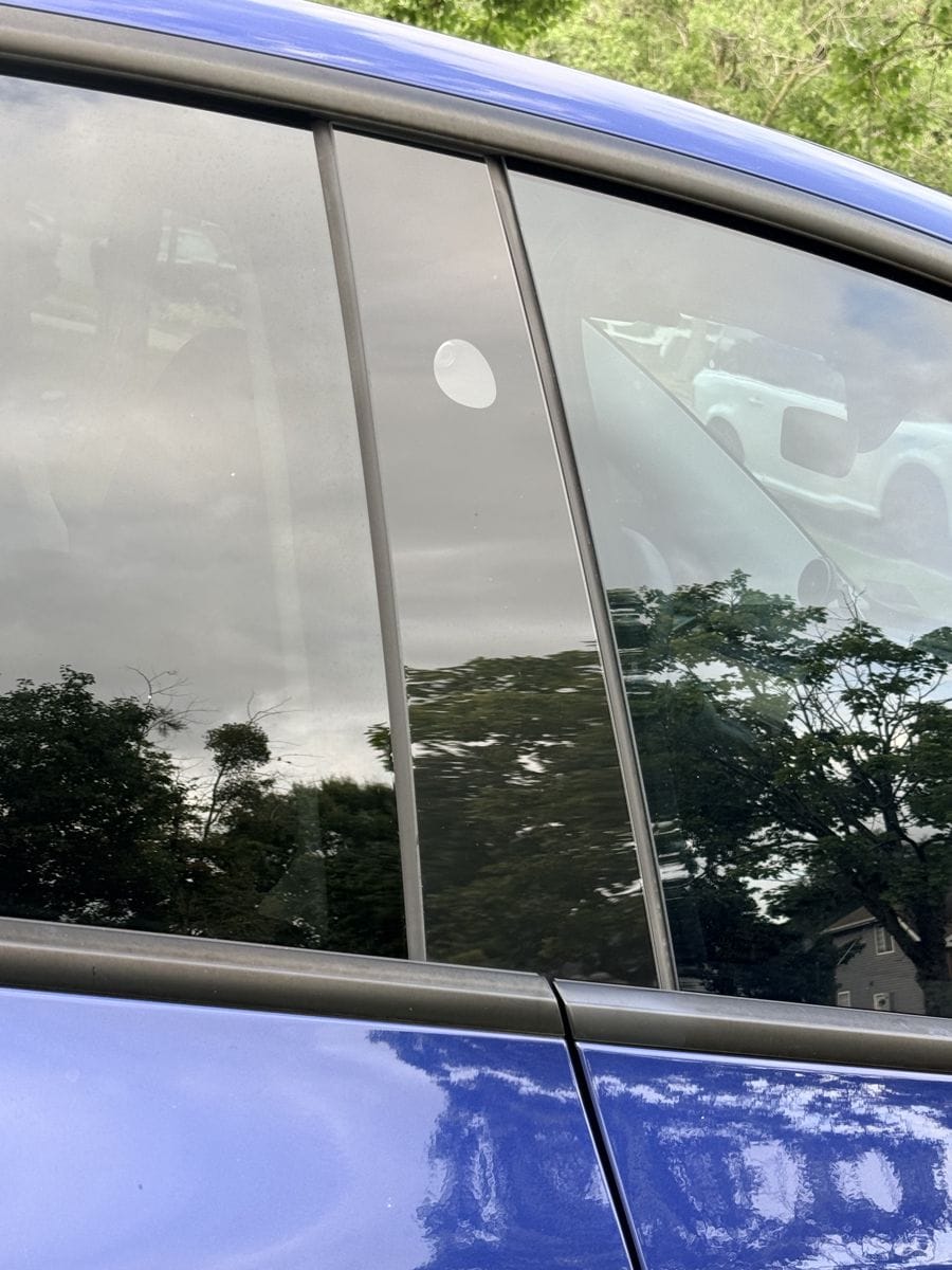 Key card tap area on the driver's side B-pillar of a Tesla Model Y