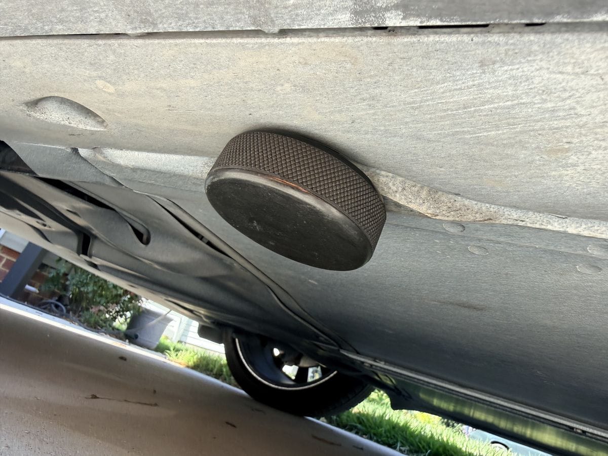 Tesla jack pad seated in the factory lift point under the side skirt