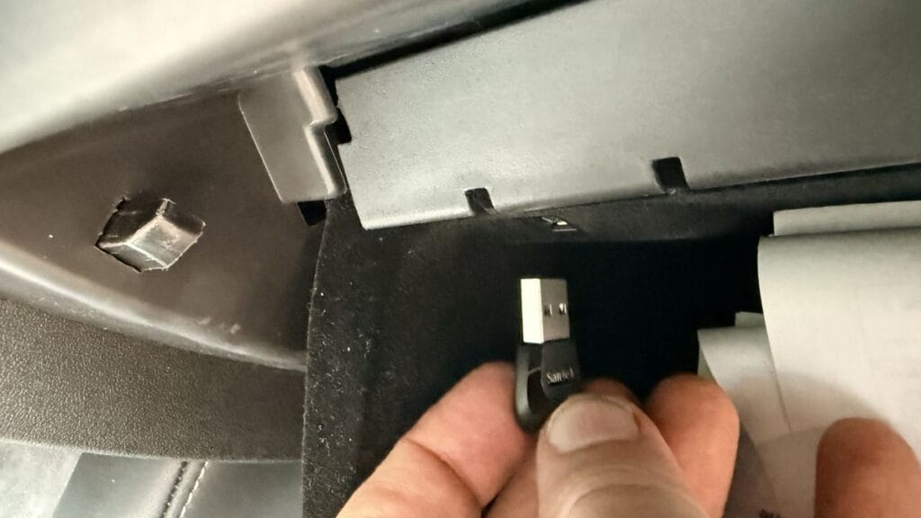 Plugging a USB drive into the Tesla glovebox port